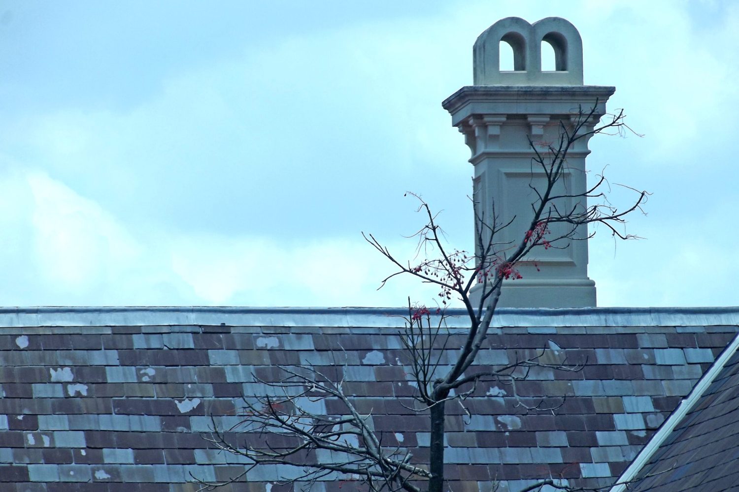 chimney-on-an-old-tiled-roof-2023-11-27-05-10-45-utc-scaled.jpg